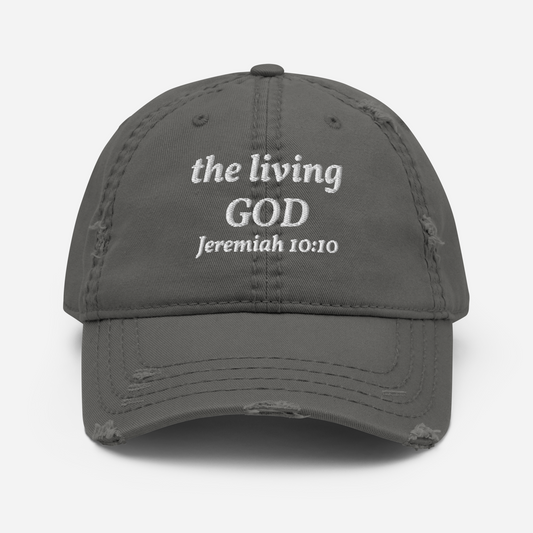 The Kingdom Mindset Dad Hat by My Store is a gray distressed cotton cap featuring “the living GOD Jeremiah 10:10” embroidered in white on the front. Adjustable for comfort, it combines timeless style with faith-inspired design.
