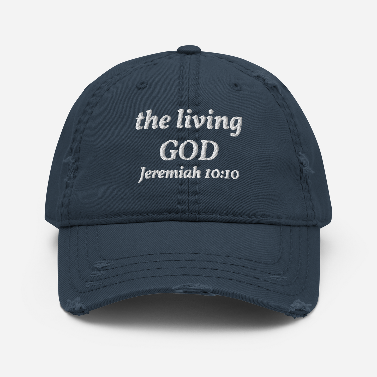 The Kingdom Mindset Dad Hat by My Store is a navy blue distressed cotton cap with the living GOD Jeremiah 10:10 embroidered in white—an ideal Christian dad hat for daily wear.