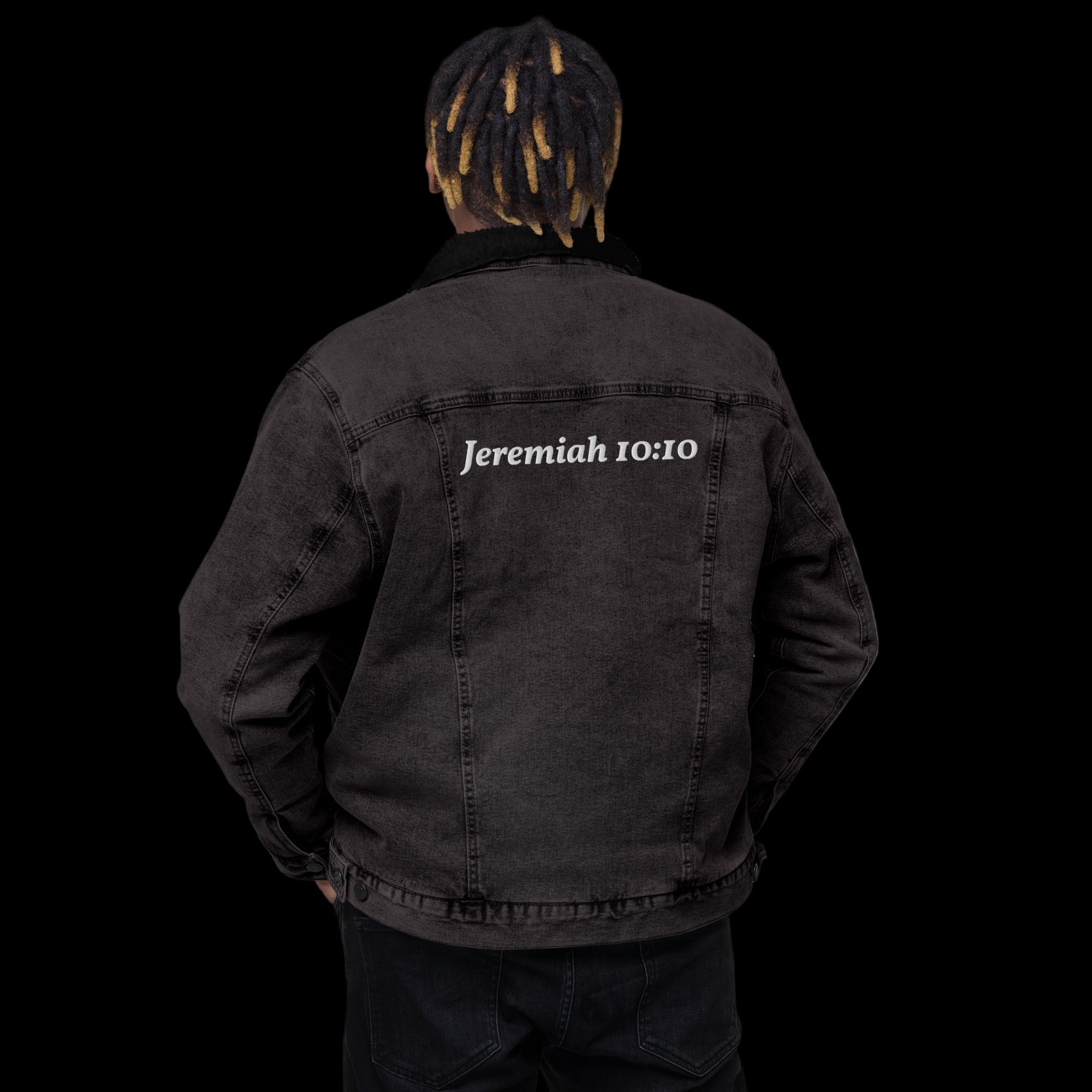 Person wearing a black sherpa jacket with 'Jeremiah 10:10' text on the back