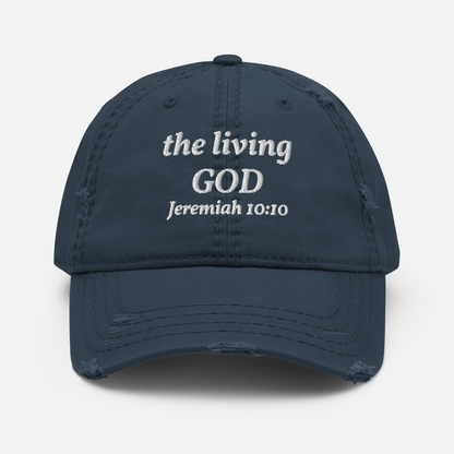 The Kingdom Mindset Dad Hat by My Store is a navy blue distressed cotton cap with the living GOD Jeremiah 10:10 embroidered in white—an ideal Christian dad hat for daily wear.