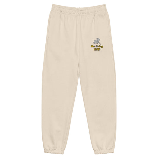 beige heavyweight fleece sweatpants with Lamb logo and yellow “the living GOD” text on thigh.