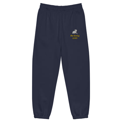 Navy blue heavyweight fleece sweatpants with Lamb logo and yellow “the living GOD” text on thigh.