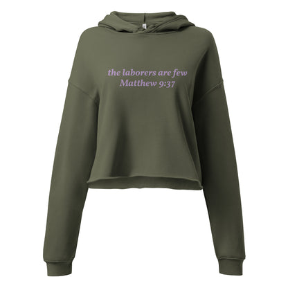 green cropped hoodie with Matthew 9:37 text on front and Lamb logo with “the living GOD – Jeremiah 10:10” on back.
