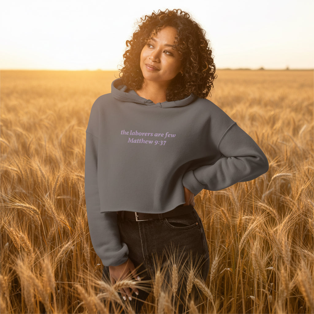 gray cropped hoodie with Matthew 9:37 text on front and Lamb logo with “the living GOD – Jeremiah 10:10” on back.
